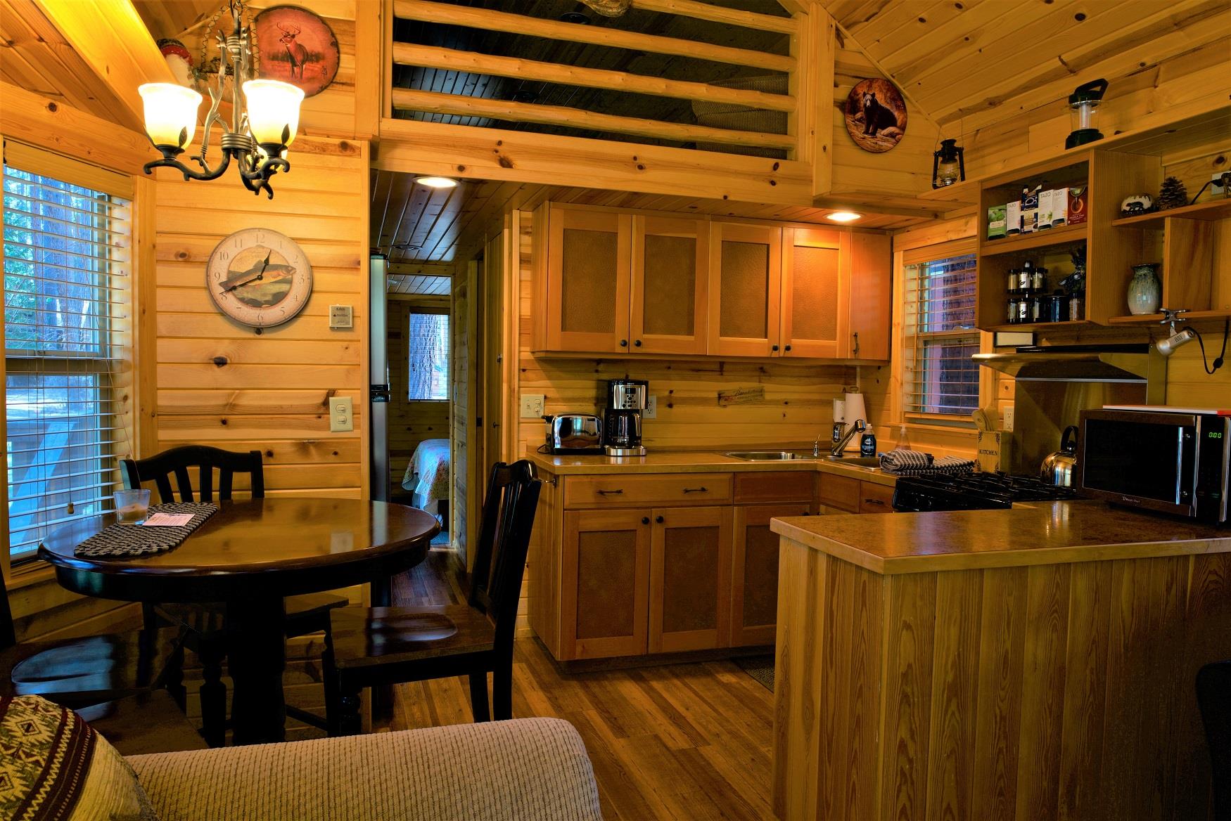 Cook up a delicious family dinner in the kitchen of Ponderosa Cabin at Cold Springs Resort & RV Park in Camp Sherman, Oregon