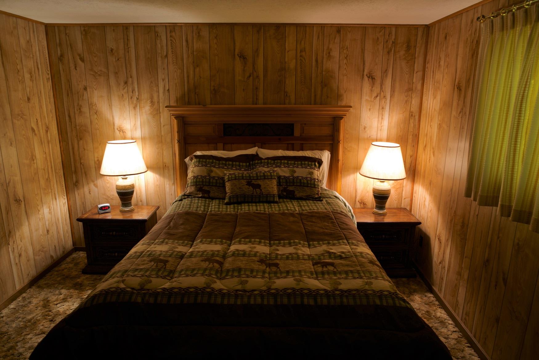 Get your best night sleep in the comfy queen bed in Haberman Cabin, at Cold Springs Resort & RV Park in Camp Sherman, Oregon