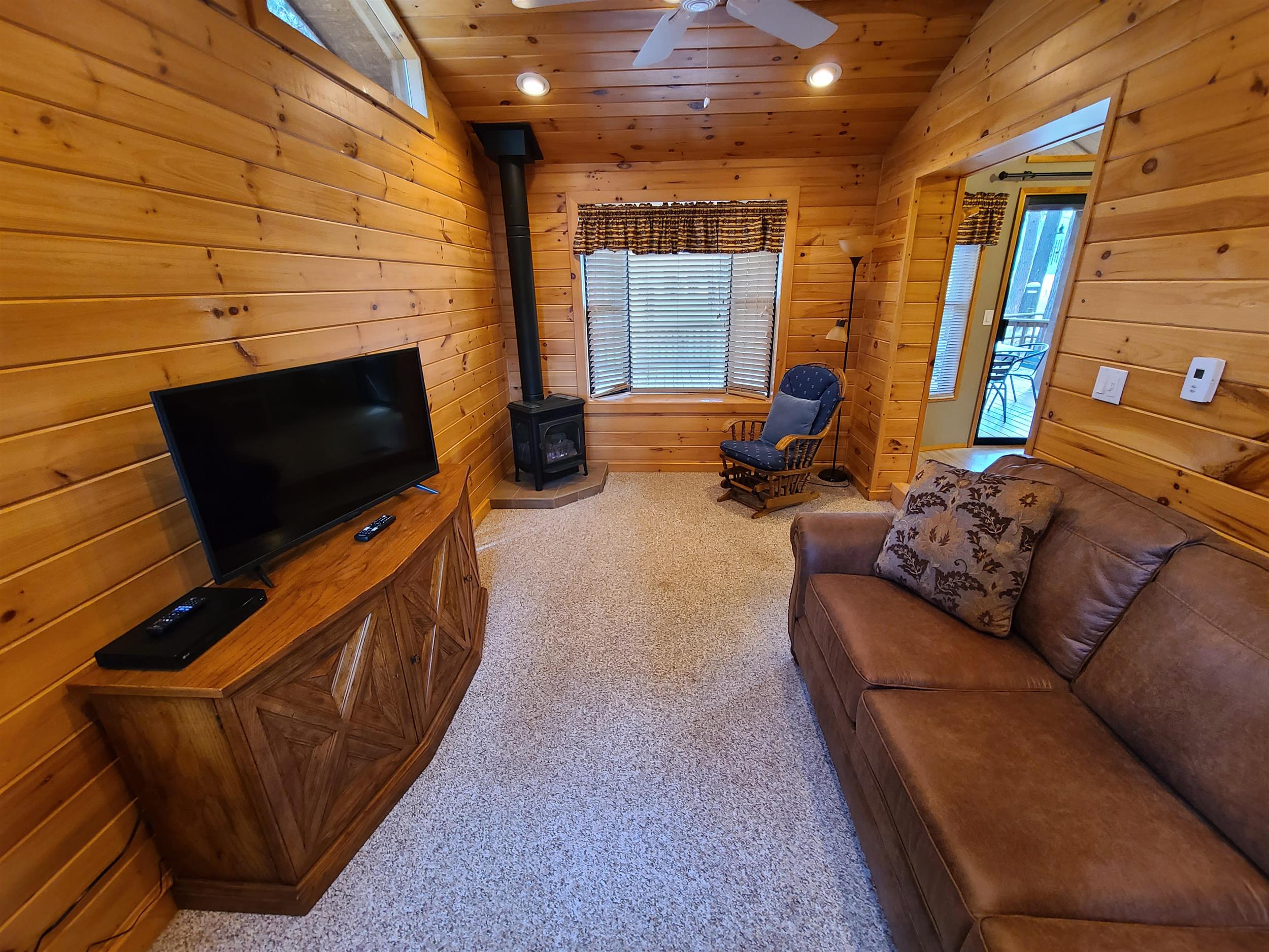 The cozy living room of Cottonwood Cabin at Cold Springs Resort & RV Park in Camp Sherman, Oregon
