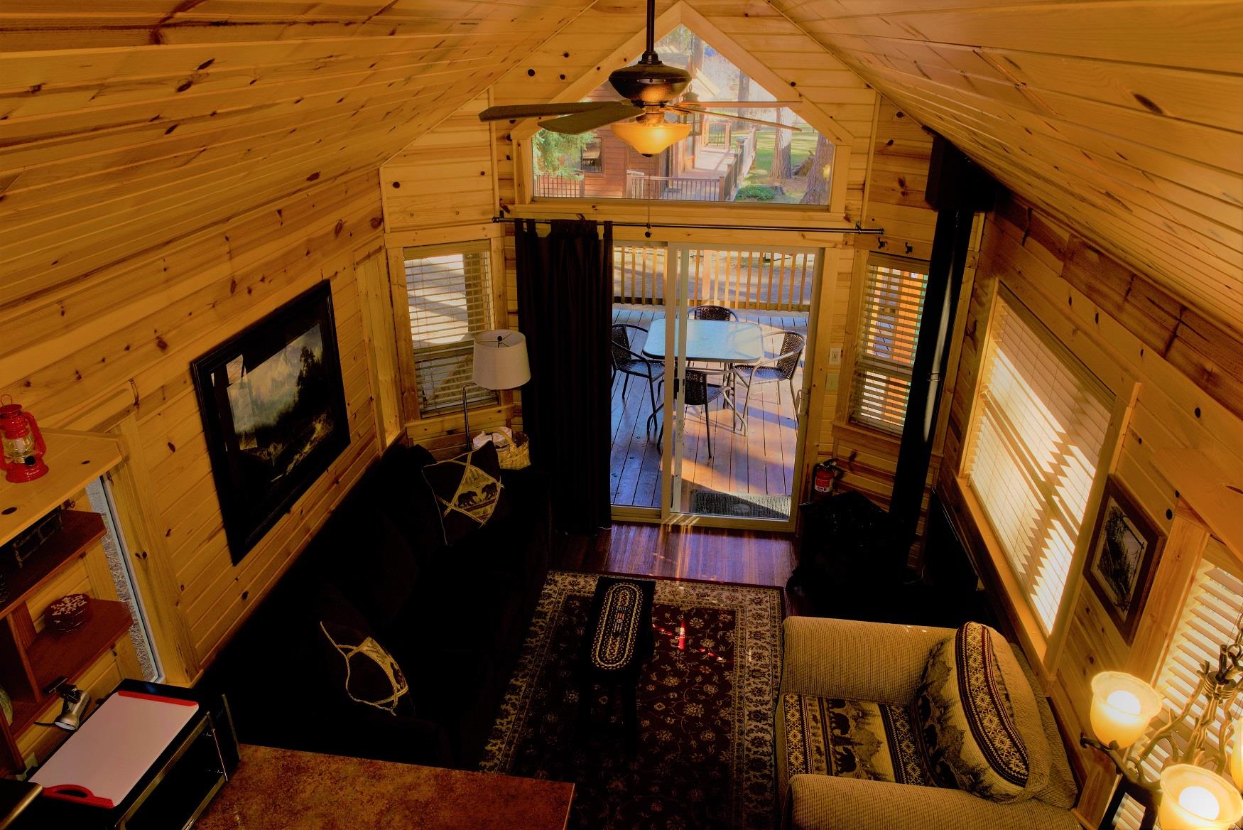 The cozy living room of Ponderosa Cabin at Cold Springs Resort & RV Park in Camp Sherman, Oregon