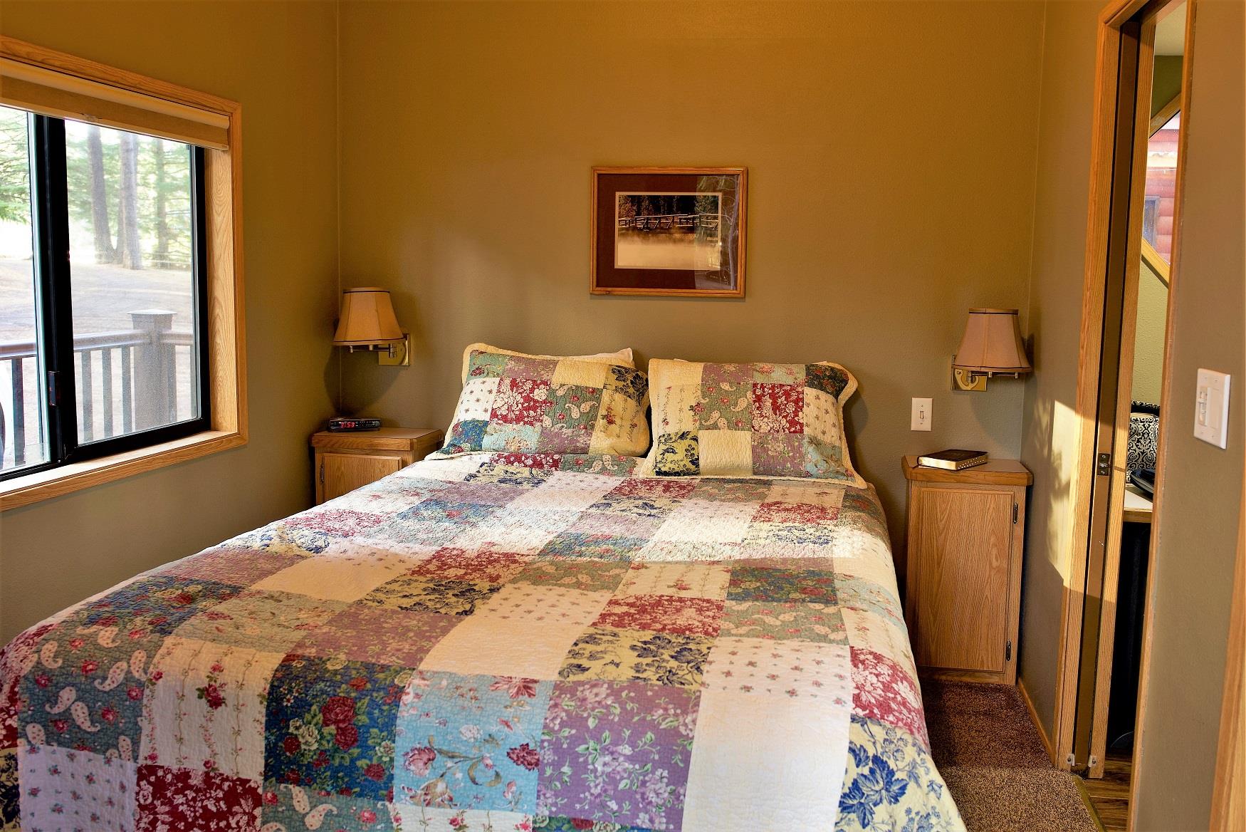 Get your best night sleep in the comfy queen bed in Spruce Cabin, at Cold Springs Resort & RV Park in Camp Sherman, Oregon