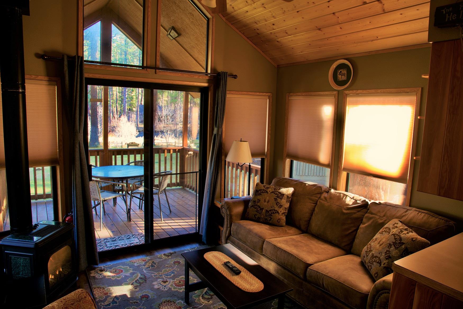 The living room of Aspen Cabin at Cold Springs Resort & RV Park in Camp Sherman, Oregon