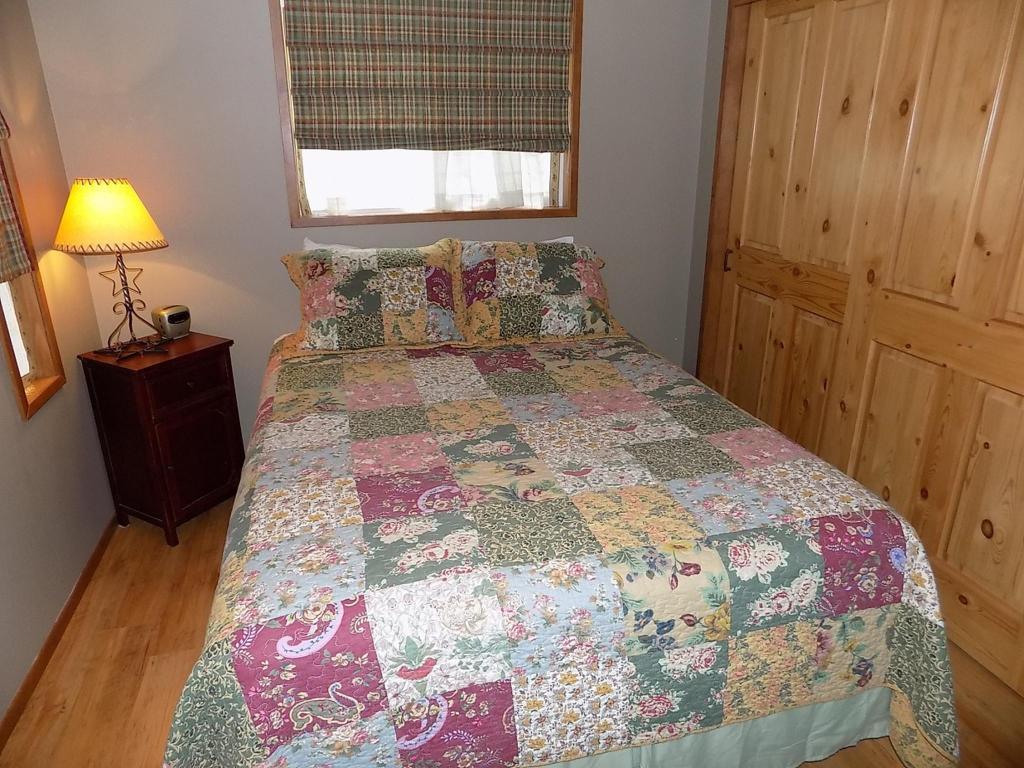 Get your best night sleep in the comfy queen bed in Pinecone Cabin, at Cold Springs Resort & RV Park in Camp Sherman, Oregon