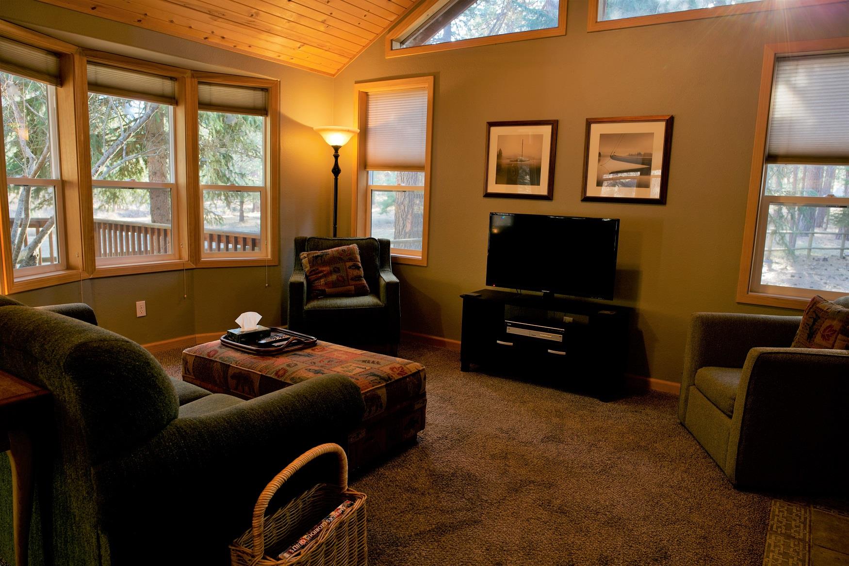 The cozy living room of Alder Cabin at Cold Springs Resort & RV Park in Camp Sherman, Oregon