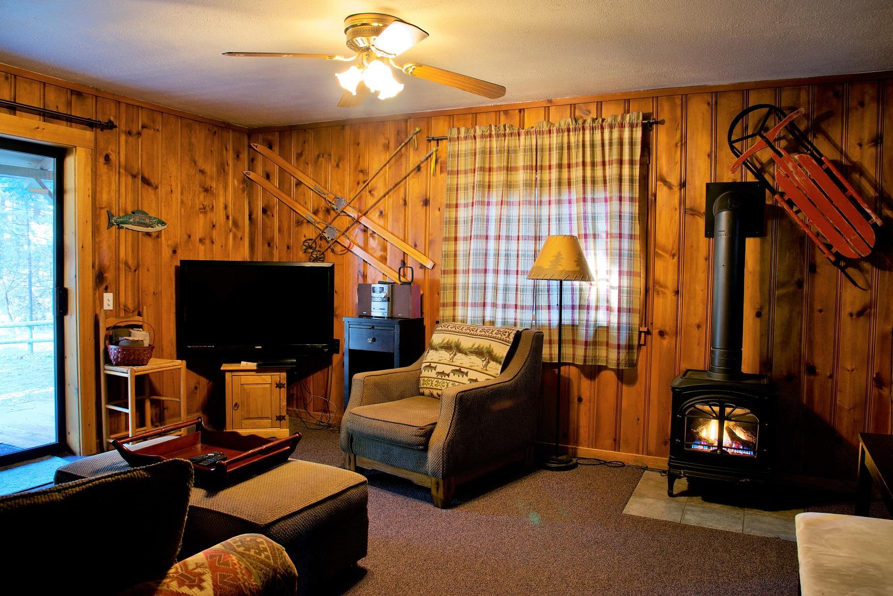 The living room of Log Cabin at Cold Springs Resort & RV Park in Camp Sherman, Oregon