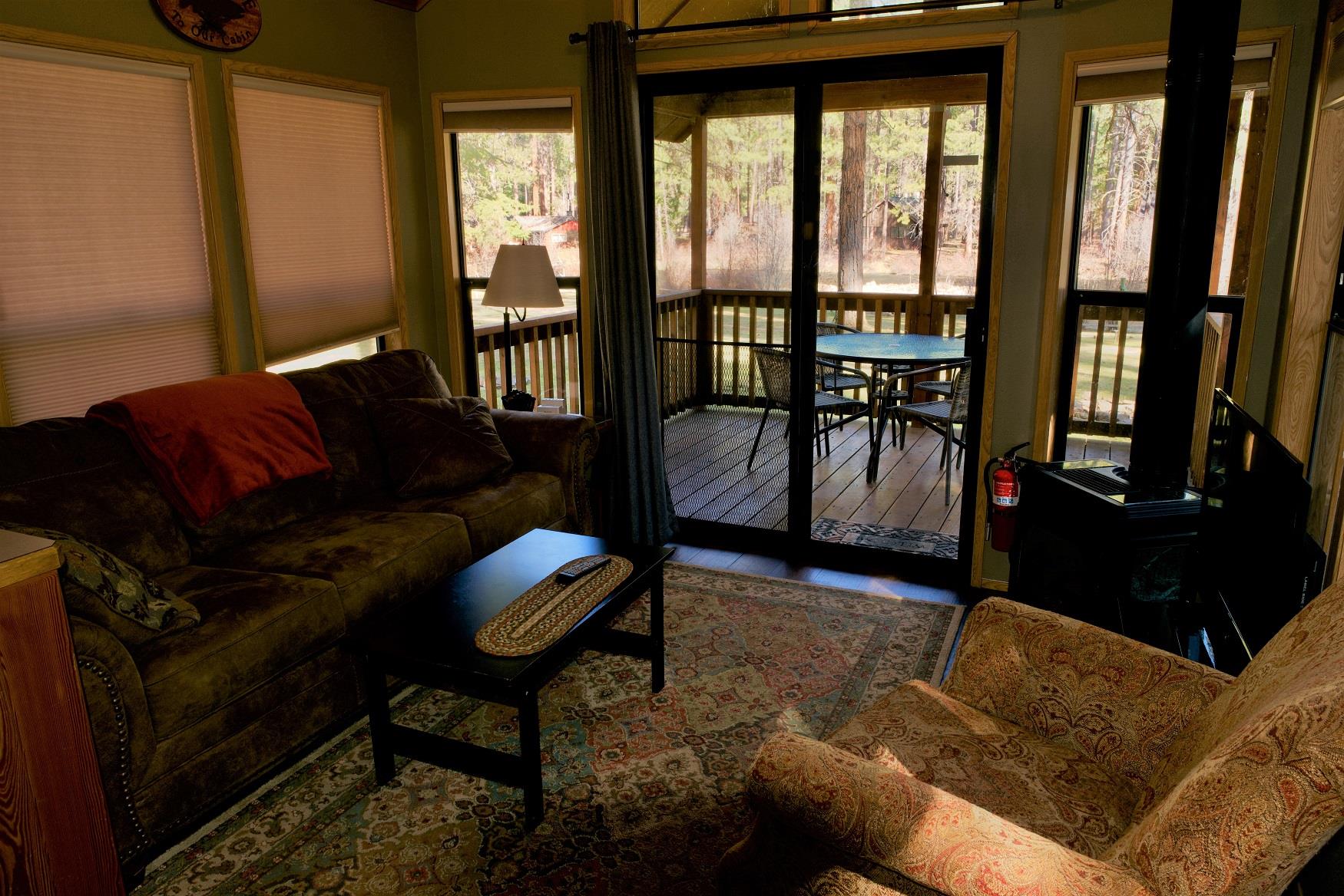 The cozy living room of Cedar Cabin at Cold Springs Resort & RV Park in Camp Sherman, Oregon