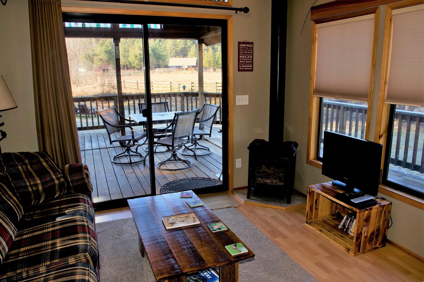 The living room of Maple Cabin at Cold Springs Resort & RV Park in Camp Sherman, Oregon