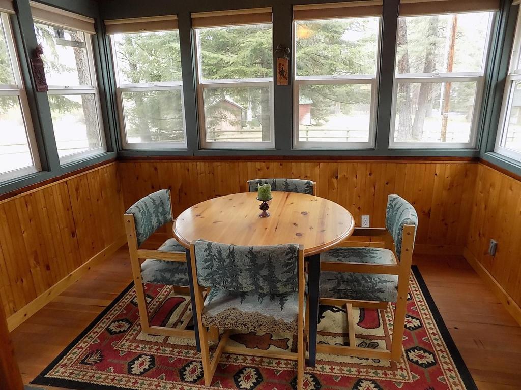 Serve up a delicious family dinner in the dining area of Pinecone Cabin at Cold Springs Resort & RV Park in Camp Sherman, Oregon