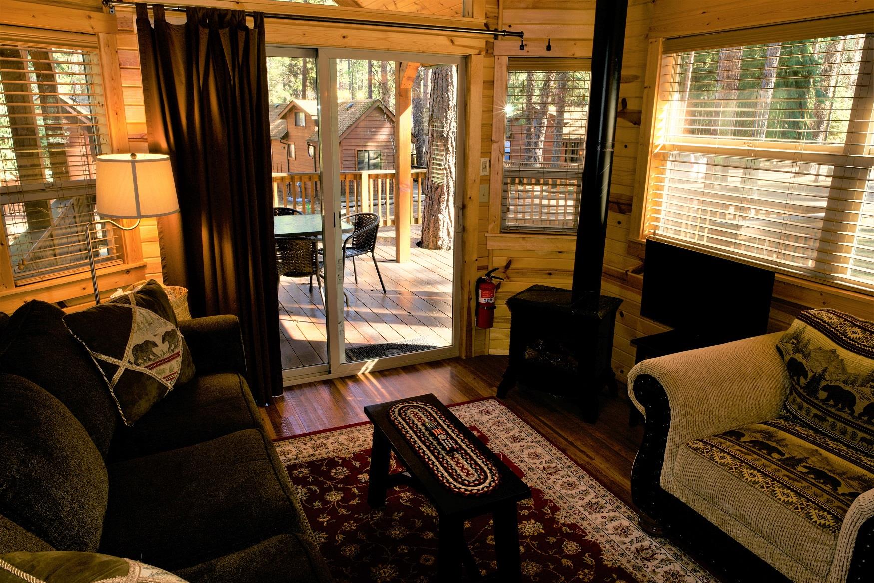 The cozy living room of Ponderosa Cabin at Cold Springs Resort & RV Park in Camp Sherman, Oregon